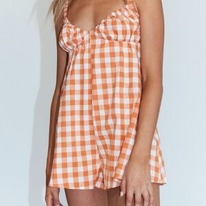 White and orange checkered romper